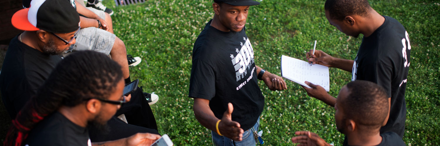 Members of 300 Men, a group dedicated to non violence in Baltimore gather for a brief meeting before walking through the streets of Belair-Edison neighborhoods in East Baltimore, Maryland