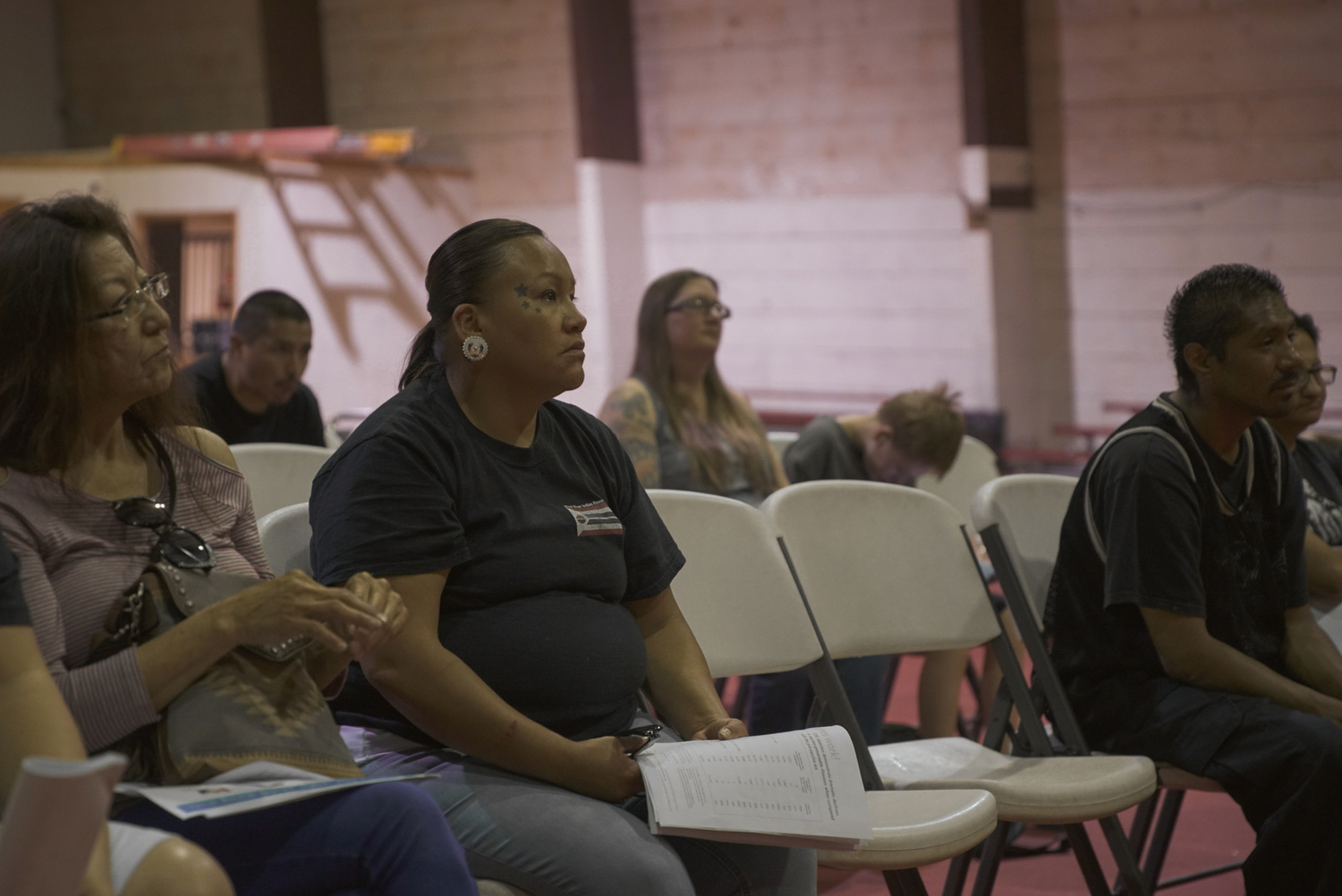 Desirae and other members of the Wind River community listen to a pediatrician speak about childhood immunizations at a lunch and presentation organized by the Wind River Family Spirit program. 