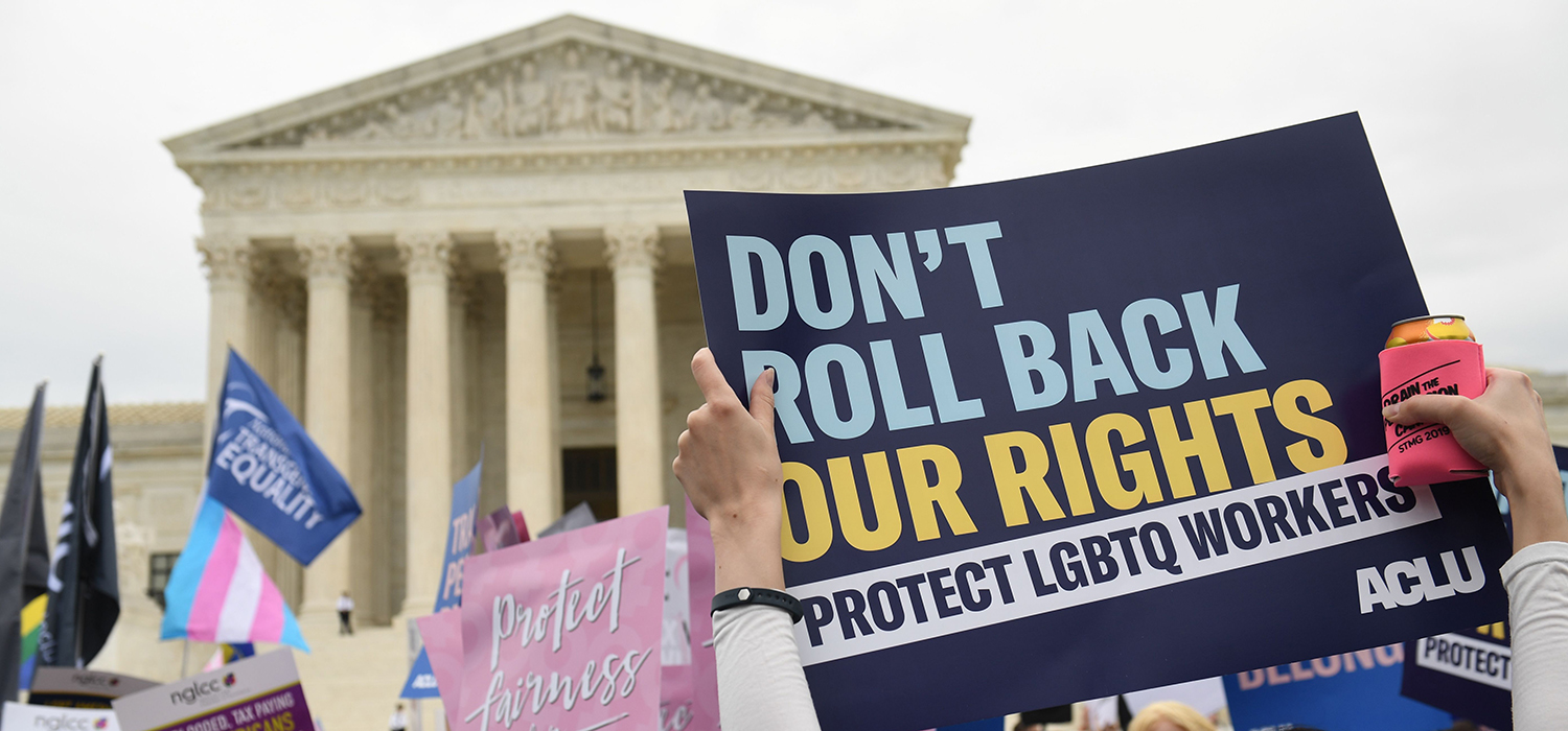 Demonstrators in favor of LGBT rights rally outside Supreme Court