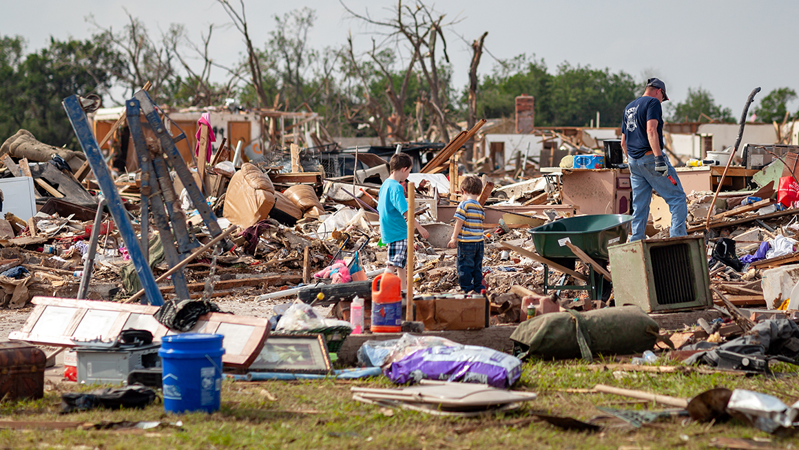 Family in storm rubble 