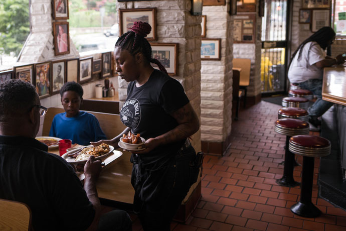 Server Donita Jackson runs food at the Florida Avenue Grill