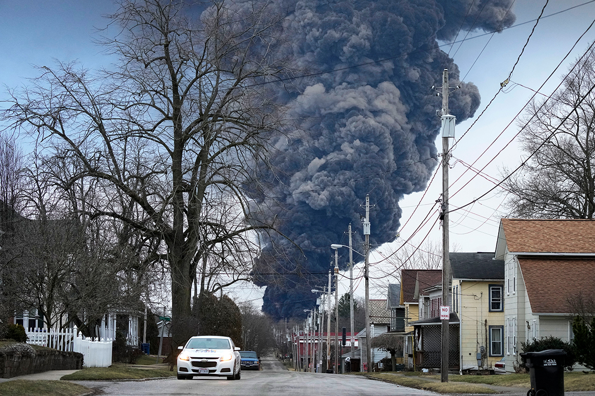 A black plume rises over East Palestine, Ohio, as a result of a controlled detonation of a portion of the derailed Norfolk Southern train
