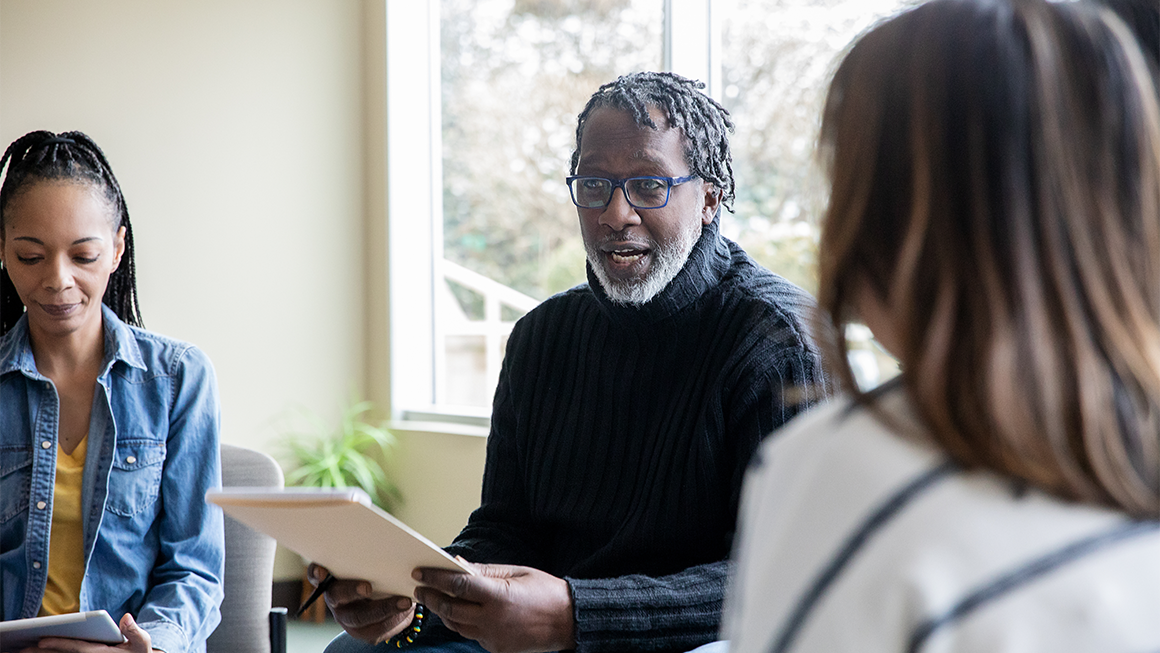 Counselors lead discussions with a variety of people participating in  support group counseling