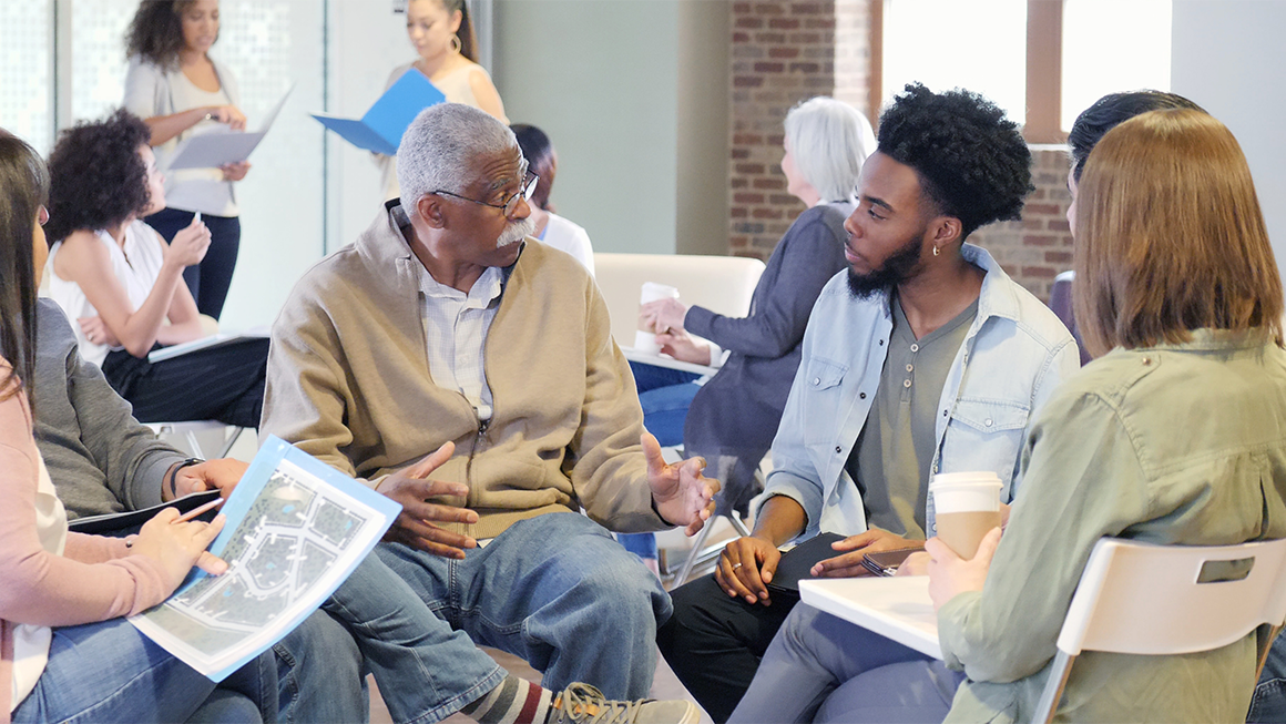 A group of adults sitting in a circle.