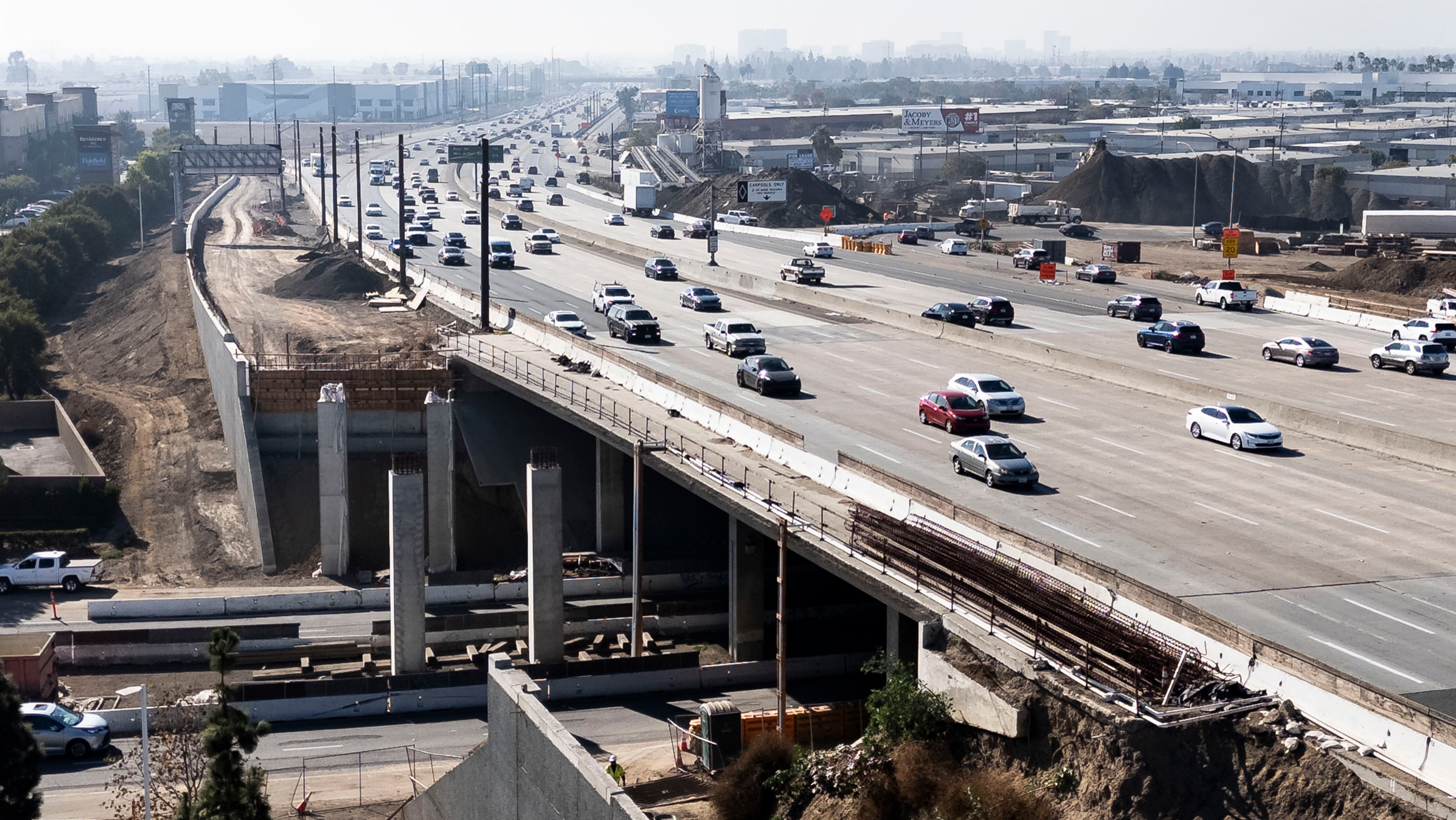 photo of freeway with multiple driving lanes