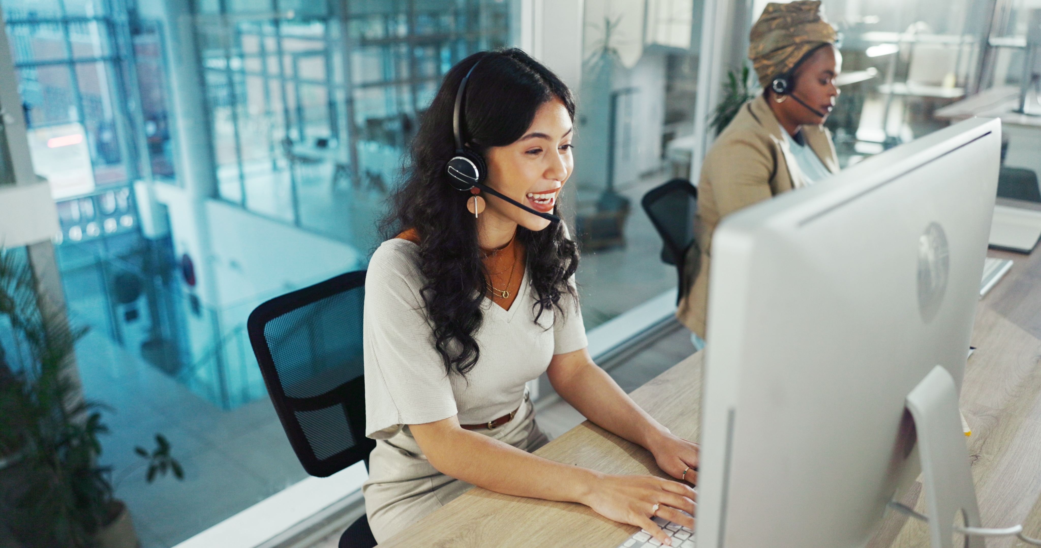 photo of woman at computer on hotline