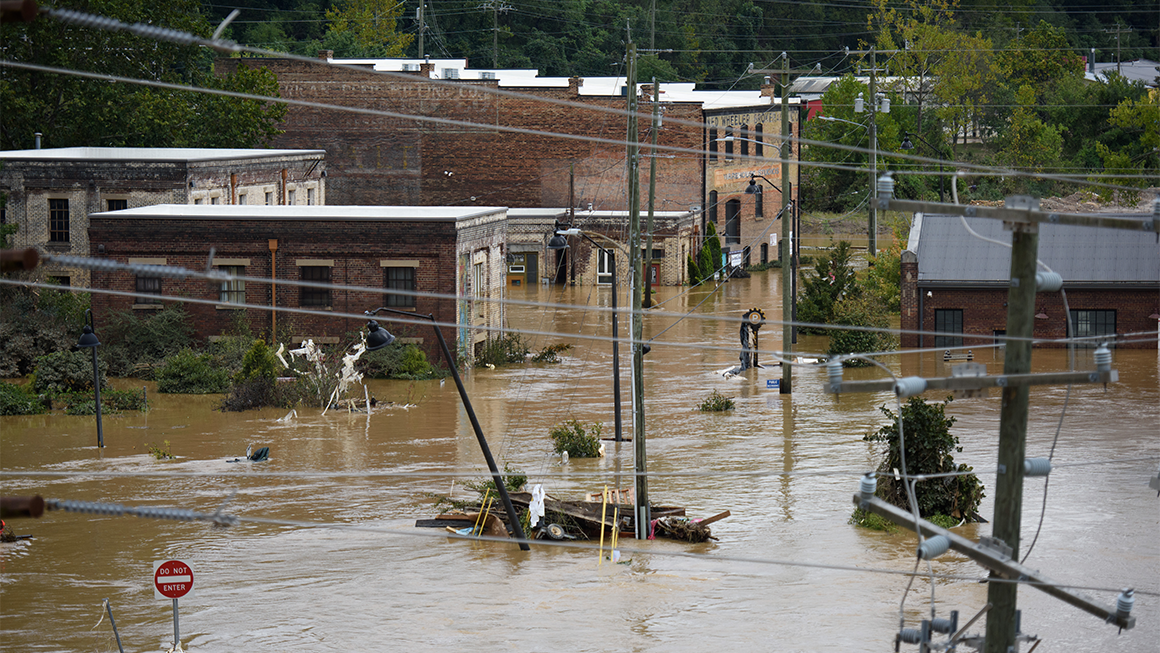 Photo of a flooded street in Asheville, North Carolina after Hurricane Helene caused record flooding and damage in September 2024