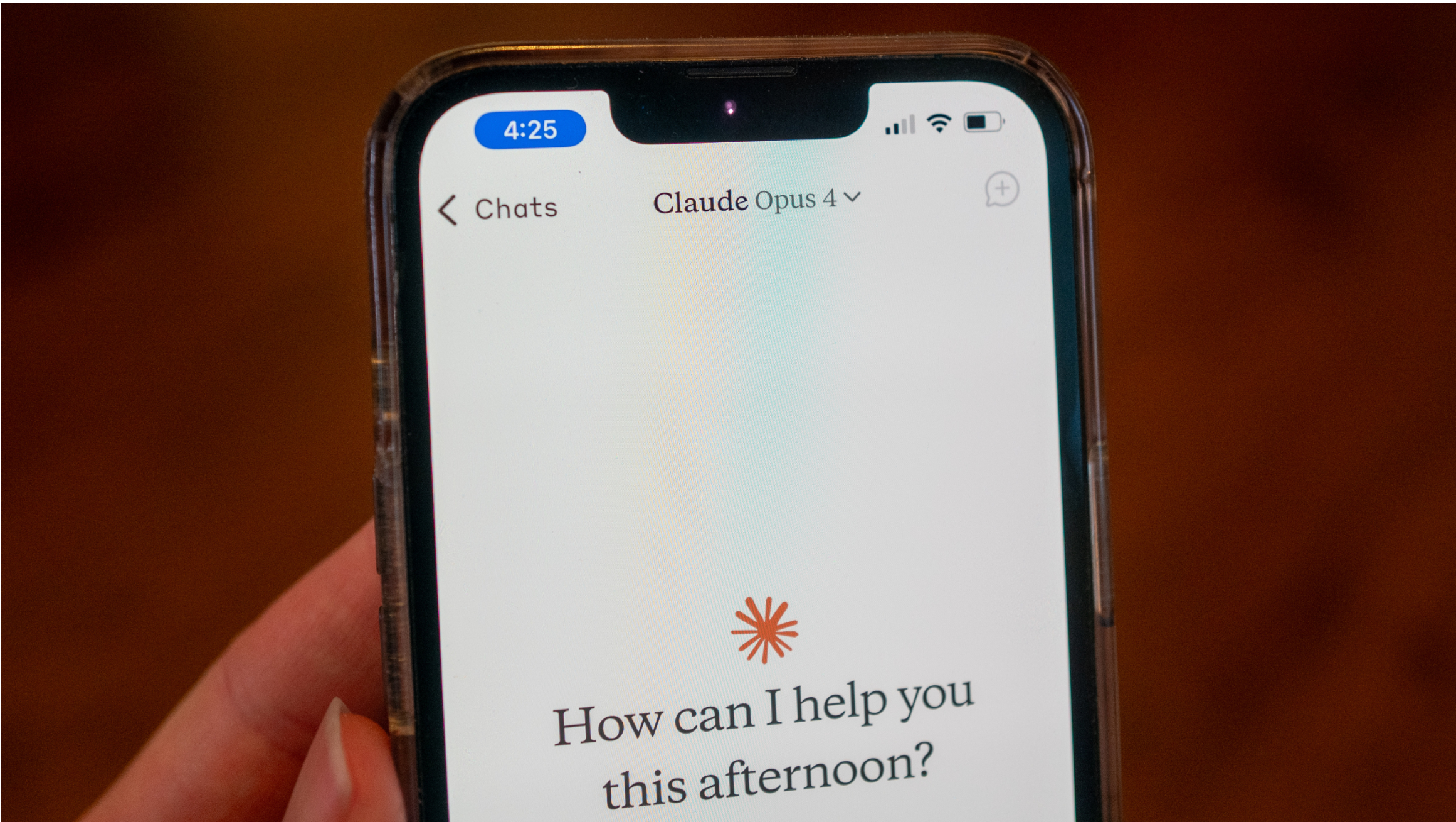 Close-up of a person's hand holding a smartphone and using the Opus 4 model within the Claude app from AI company Anthropic, Lafayette, California, May 22, 2025. (Photo by Smith Collection/Gado/Getty Images)