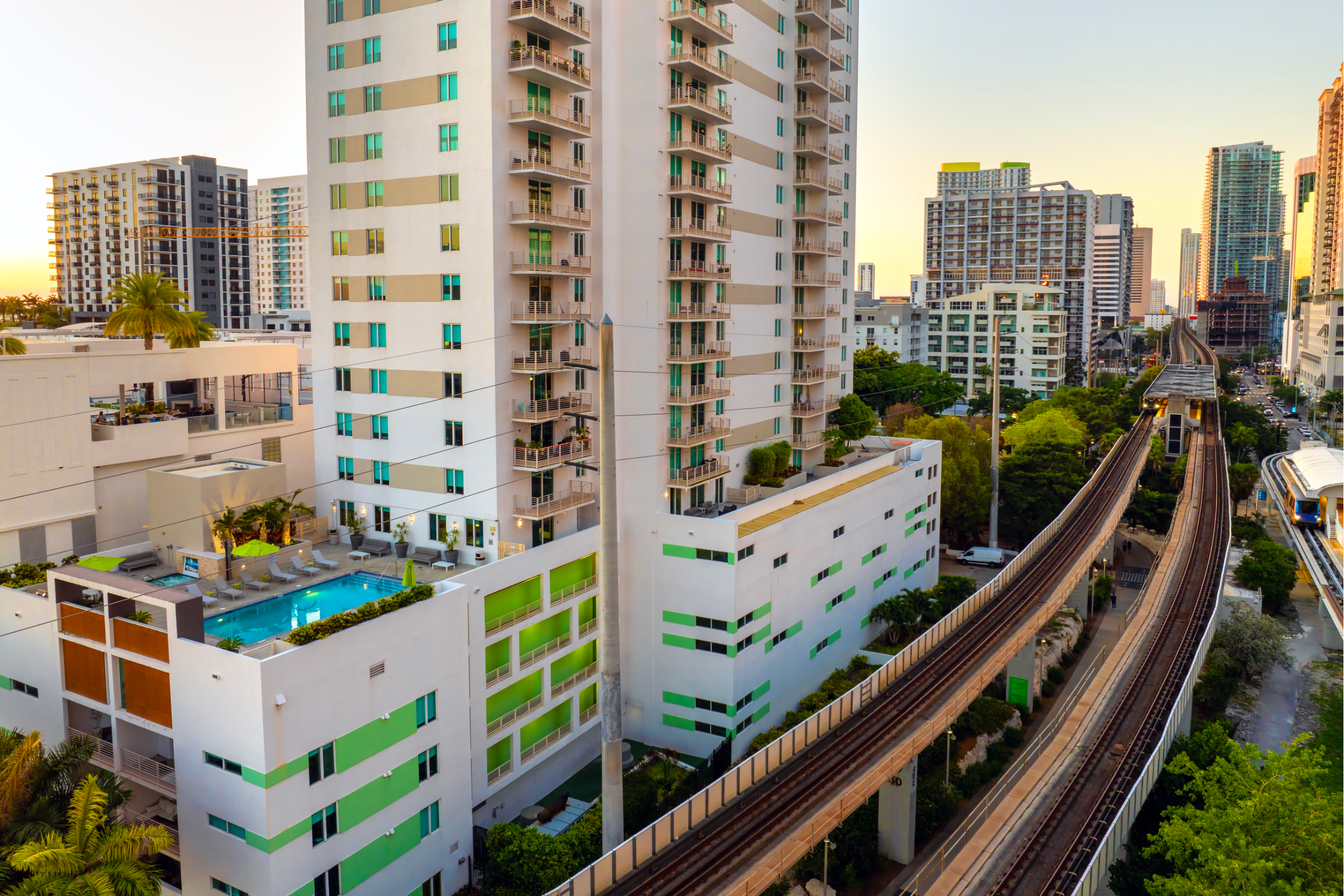 Tracks for a public train system surrounded by apartments in Miami, Florida. 