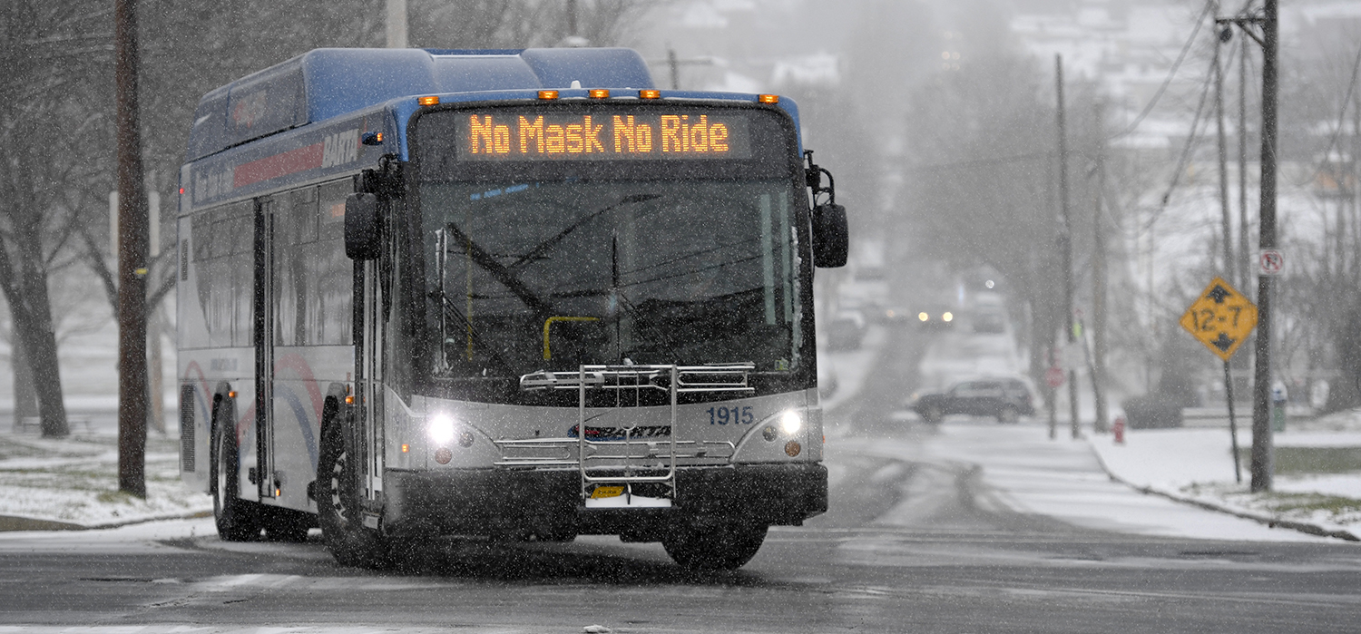 A bus message reads "No Mask No Ride"