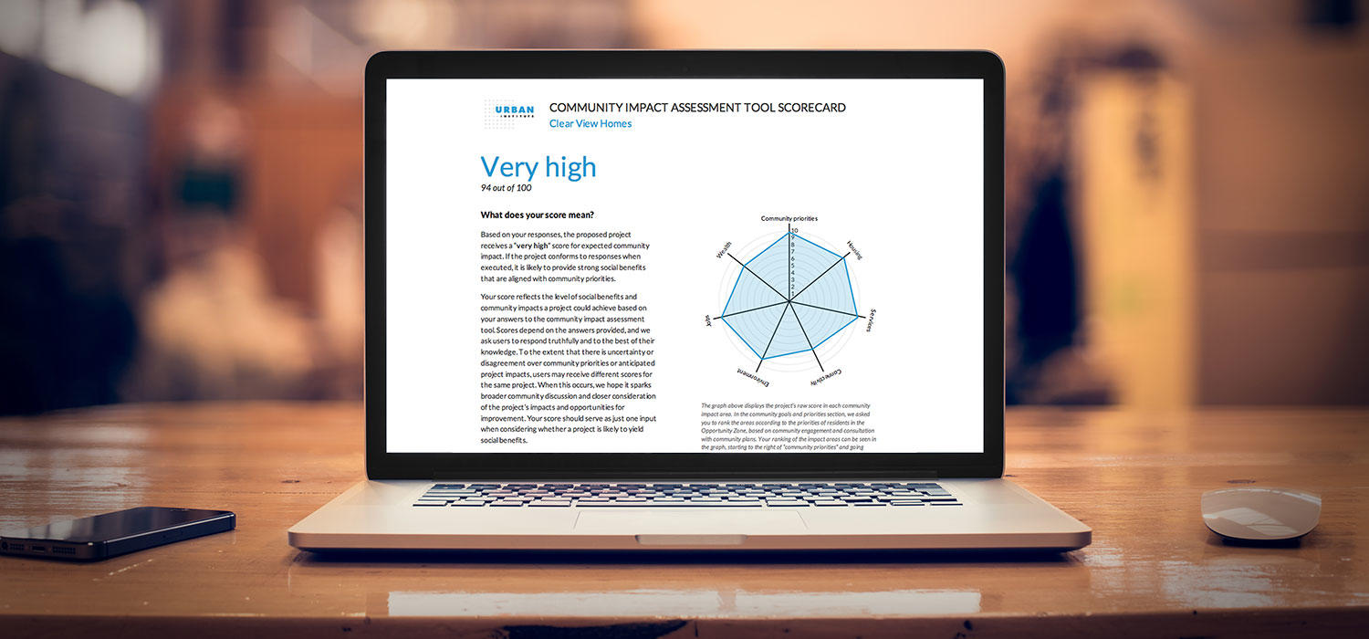 laptop opened to a scorecard of the opportunity zone assessment tool, that reads high score