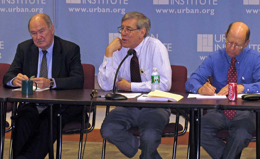 Urban Institute President, Robert Reischauer (center) speaks at the annual budget roundtable discussion in 2008.