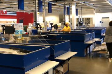 Interior of cashier's check and furniture showcase, large IKEA store with a wide range of products.