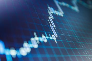 Financial statistic analysis on dark background with growing financial charts
