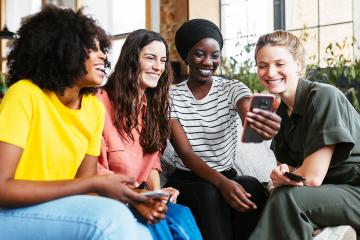 photo of women sitting together