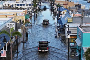 Flood waters inundate the main street after Hurricane Helene passed offshore on September 27, 2024, in Tarpon Springs, Florida. 