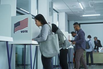 photo of person voting at voting booth