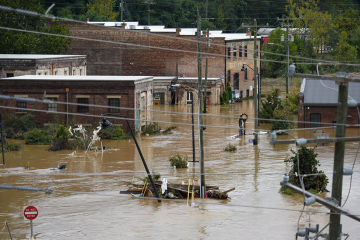 Photo of a flooded street in Asheville, North Carolina after Hurricane Helene caused record flooding and damage in September 2024