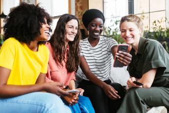 photo of women sitting together