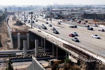 photo of freeway with multiple driving lanes