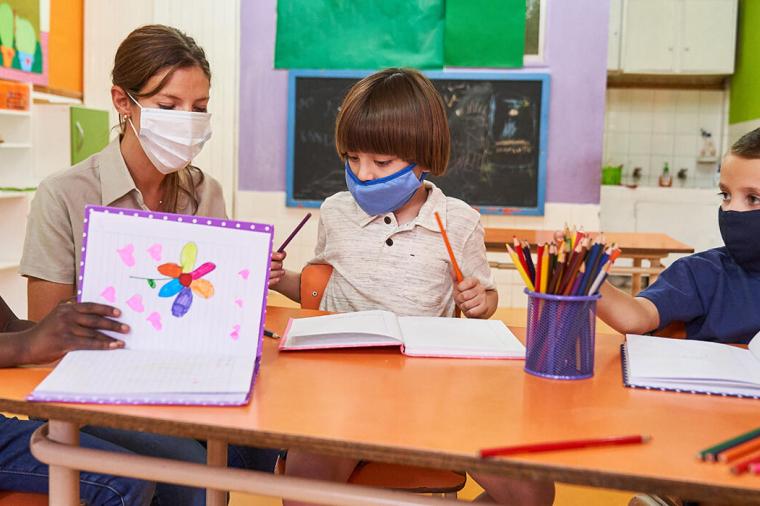 Elementary school teacher with children