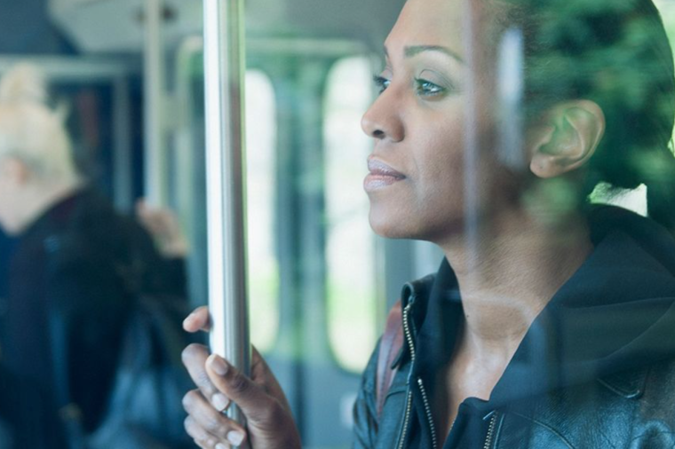 Image of Black woman on public transit