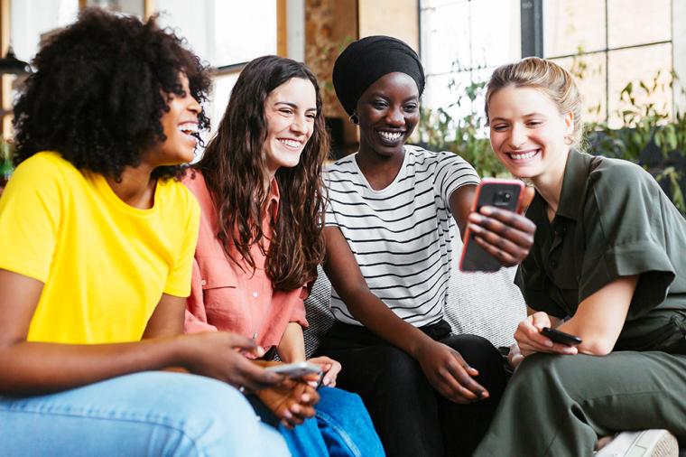 photo of women sitting together