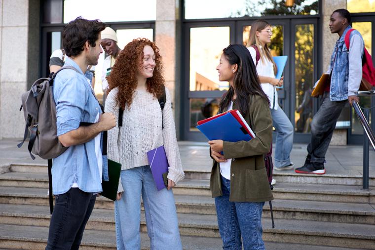 photo of young students standing together in college setting