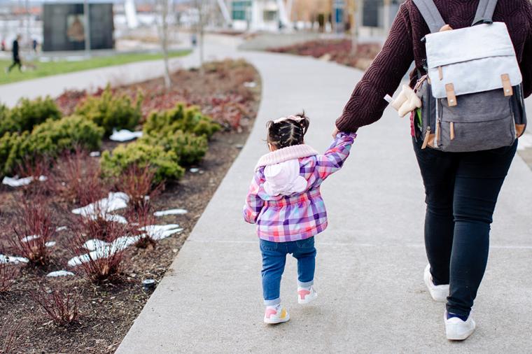 photo of parent walking with child