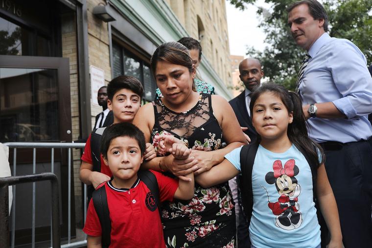 photo of  Immigrant Mother Reunited With Her Three Children After Being Detained Separately