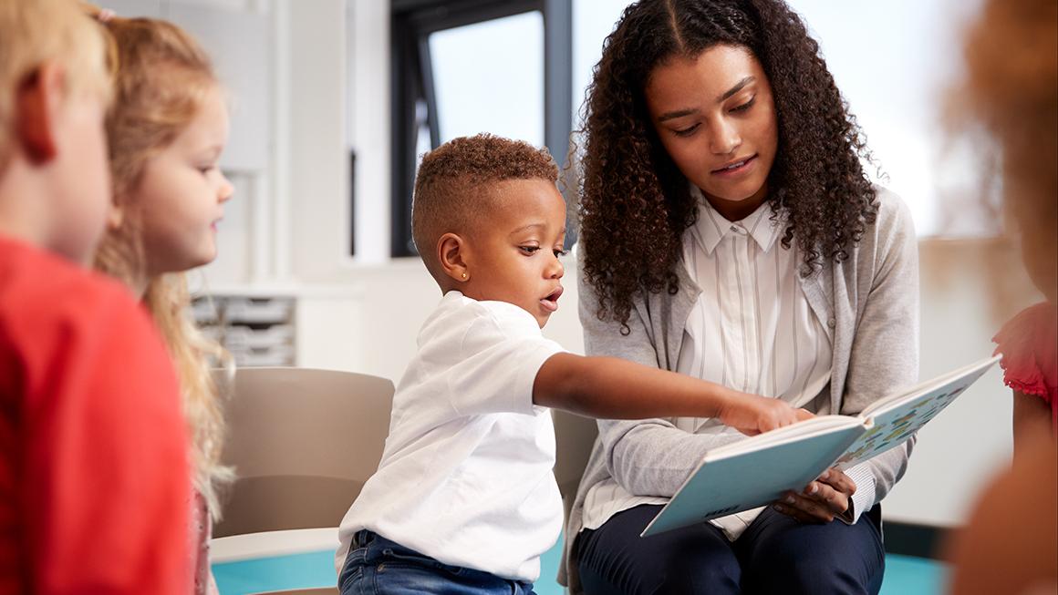 child reading with woman