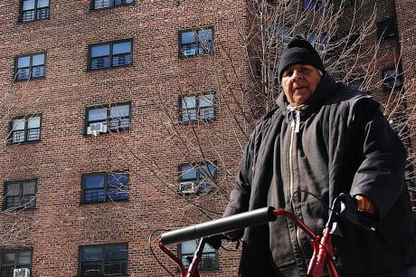 A man walks by the Farragut Houses, a public housing project in Brooklyn on March 16, 2017 in New York City.