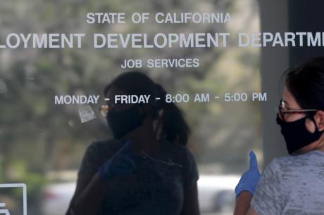 Maria Mora came to find information about her claim but found the California State Employment Development Department was closed due to coronavirus concerns on Thursday, May 14, 2020 in Canoga Park, CA.