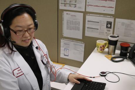Interpreter speaks with patients from a health care call center