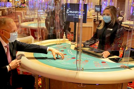 Man plays table games at a casino during COVID-19