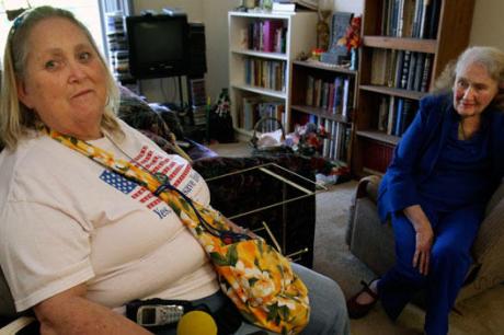 Two elderly women sitting in living room