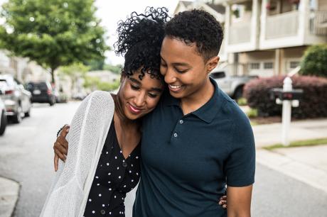 Two people hugging.