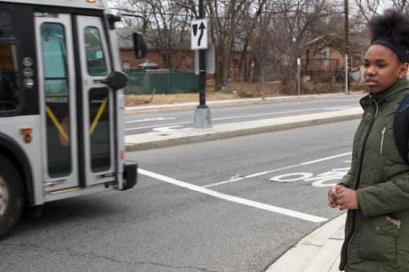 India waits to cross an intersection on her walk home from Kelly Miller Middle School
