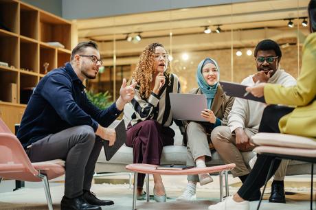 Multi-ethnic group of people discussing ideas in a meeting room in the office.
