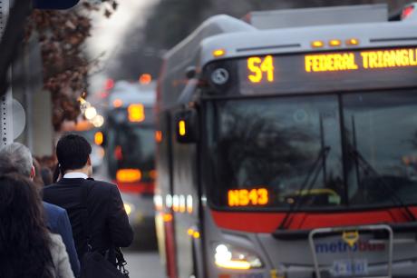 photo of bus riders waiting for a bus on 16th Street near U Street in Washington, DC