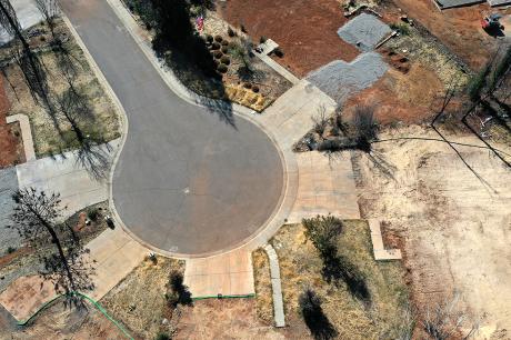 An aerial view of a neighborhood destroyed by the Camp Fire October 21, 2019 in Paradise, California