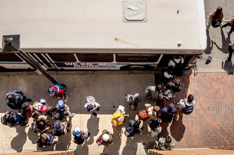 photo of riders disembarking and boarding a METRO bus