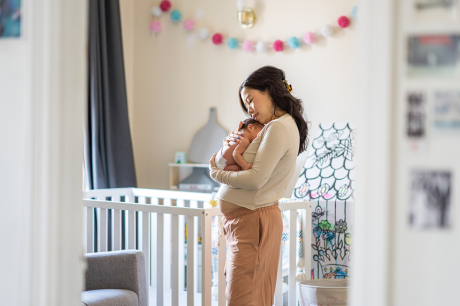 Mother with her child in her home.