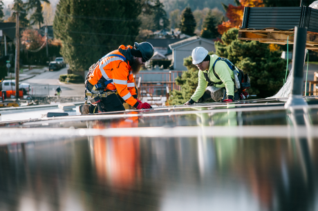 Workers installing solar pannels