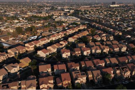 Aerial view of a suburban neighborhood with rows of single-family homes.