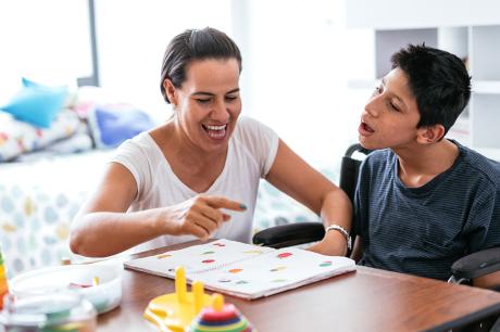 Parent teaches their child with a disability at home