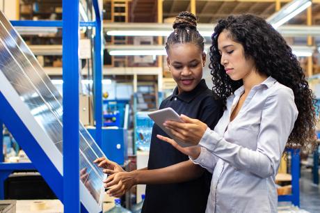 Women work together in a factory
