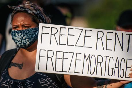 Freeze rent freeze mortgage sign at a march