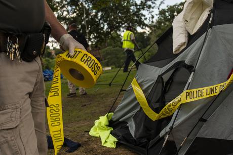 Police marks tent for removal at a homeless encampment