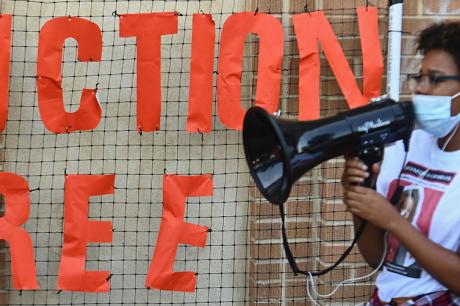 Community member protests evictions